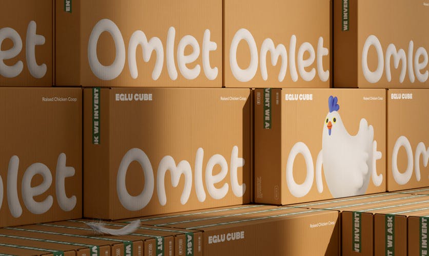 A stack of cardboard boxes labelled 'Omlet'