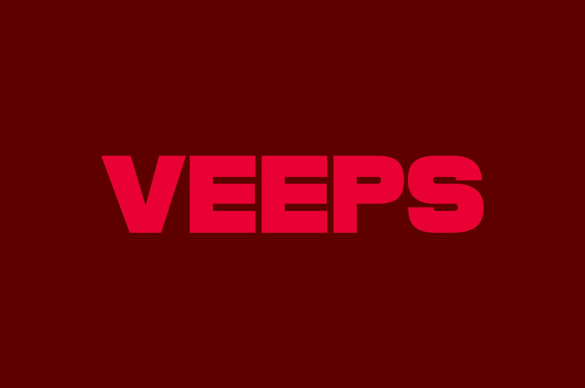 Veeps wordmark in red blocky uppercase letters against a maroon background