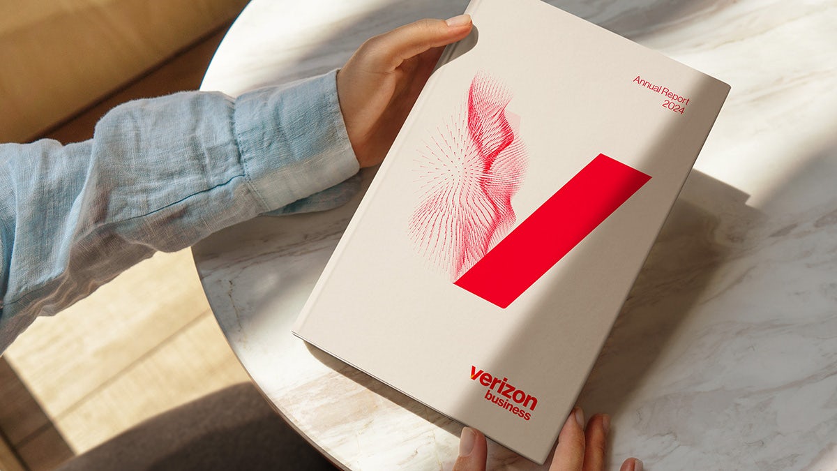 Verizon's new 'V' symbol, featuring a wavy pattern embedded into the left side of the 'V', shown on a booklet 