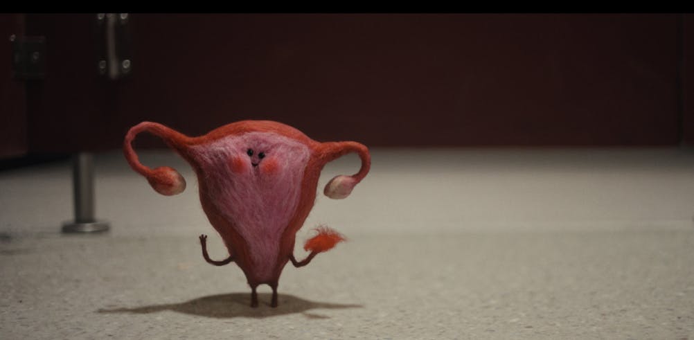 Still from a Libresse ad featuring a small felt puppet in the shape of a uterus