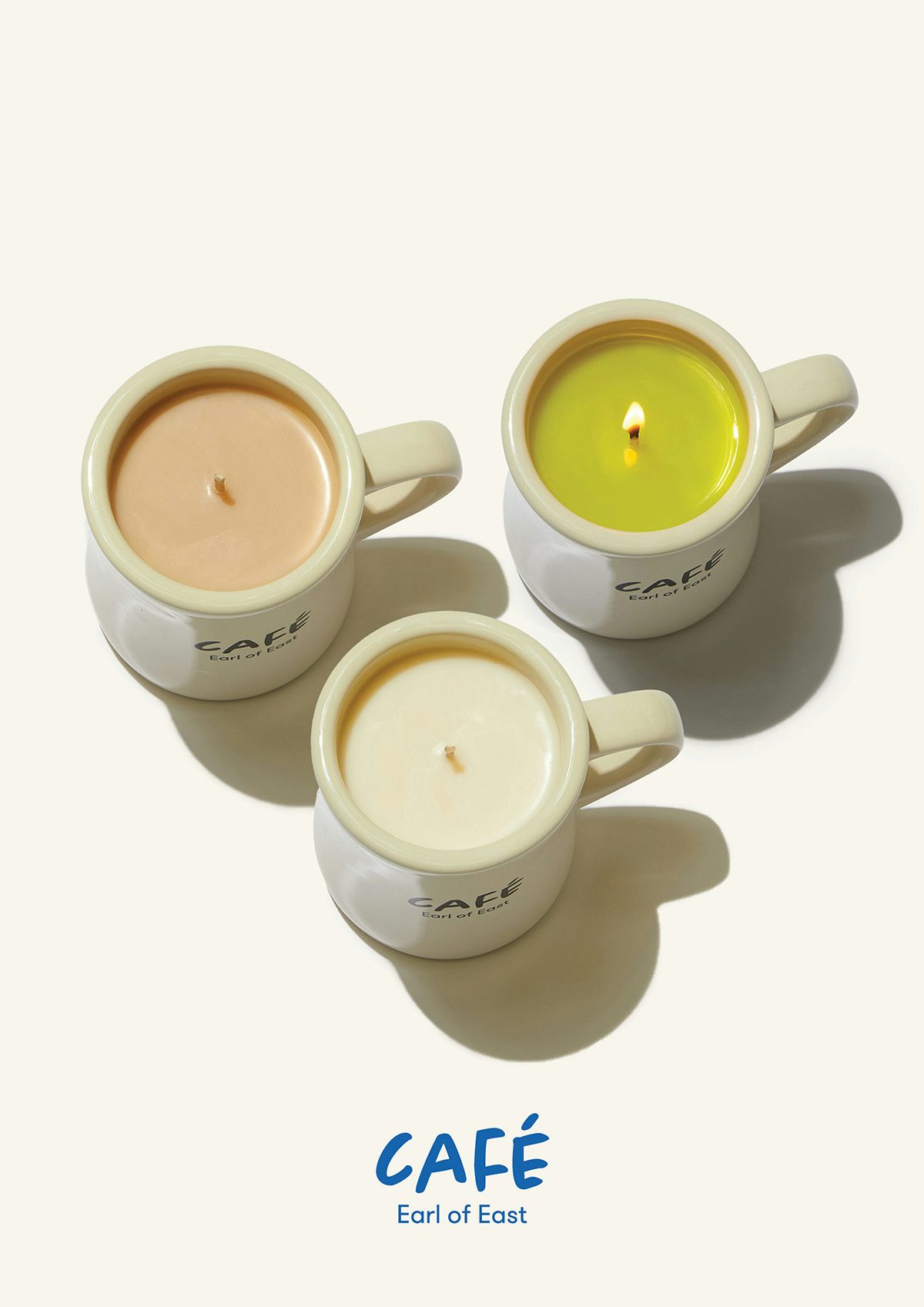 Three candles poured in mugs