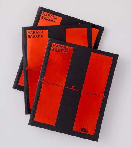 A stack of three books all featuring contrasting black and red cover design, and titled Haraka Baraka