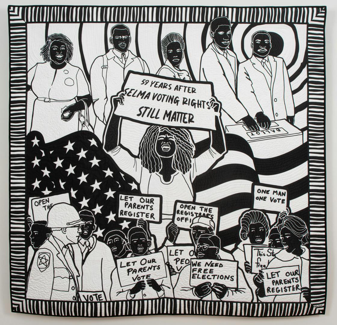 Black and white quilt depicting Black figures holding placards highlighting voting rights