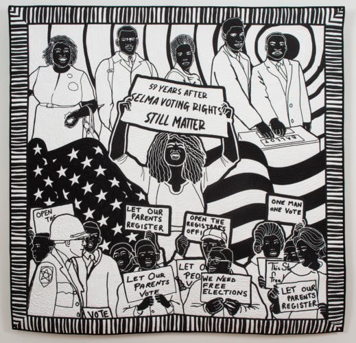 Black and white quilt depicting Black figures holding placards highlighting voting rights