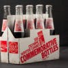 Eight pack of Coca-Cola glass bottles in a white and red commemorative cardboard holder for the 1980 Winter Olympic Games