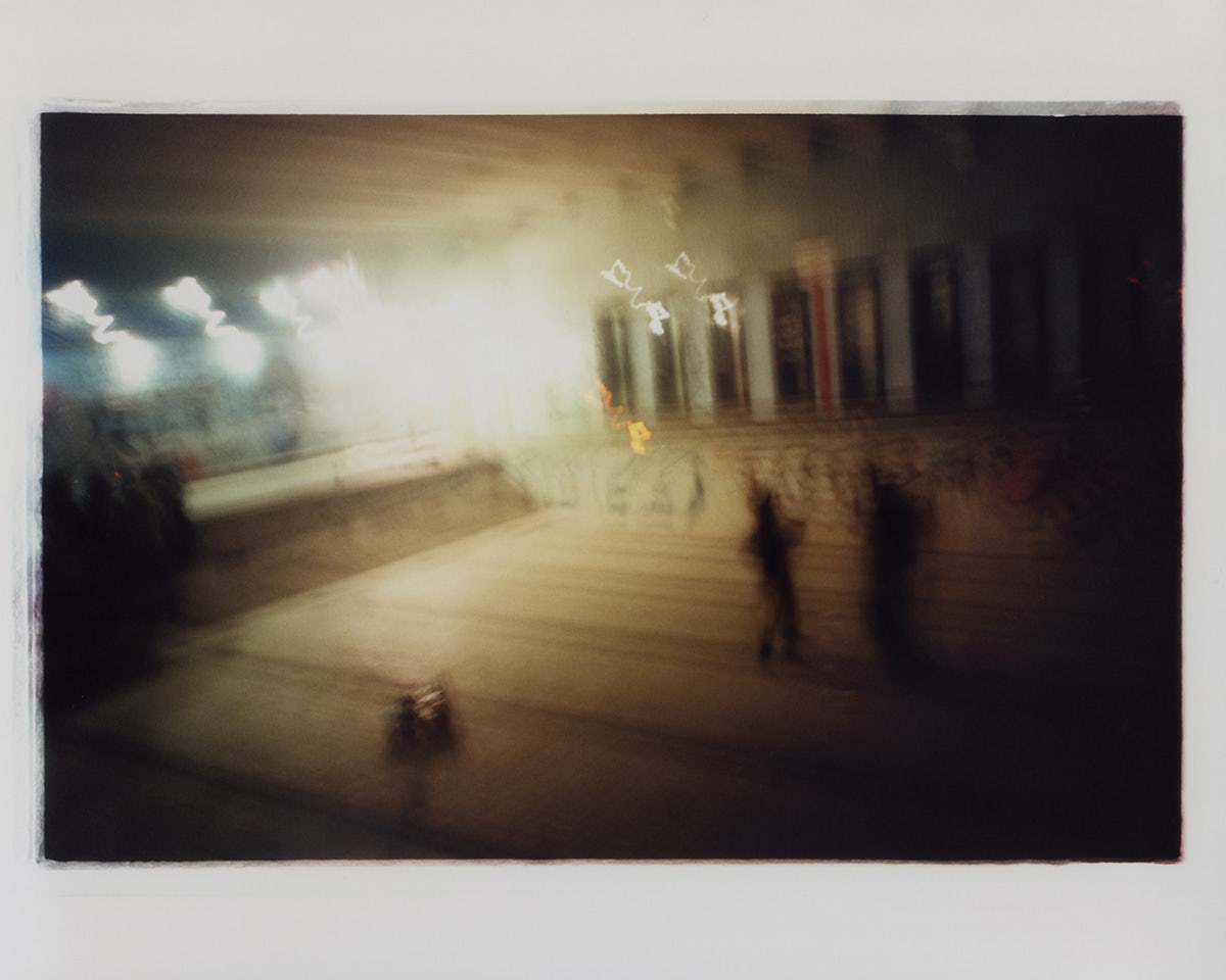 Blurred abstract photo of figures in a room