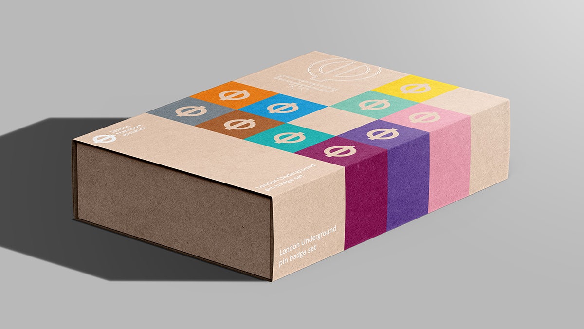A London Transport Museum branded packaging box featuring a grid of London Tube line symbols in different coloured squares