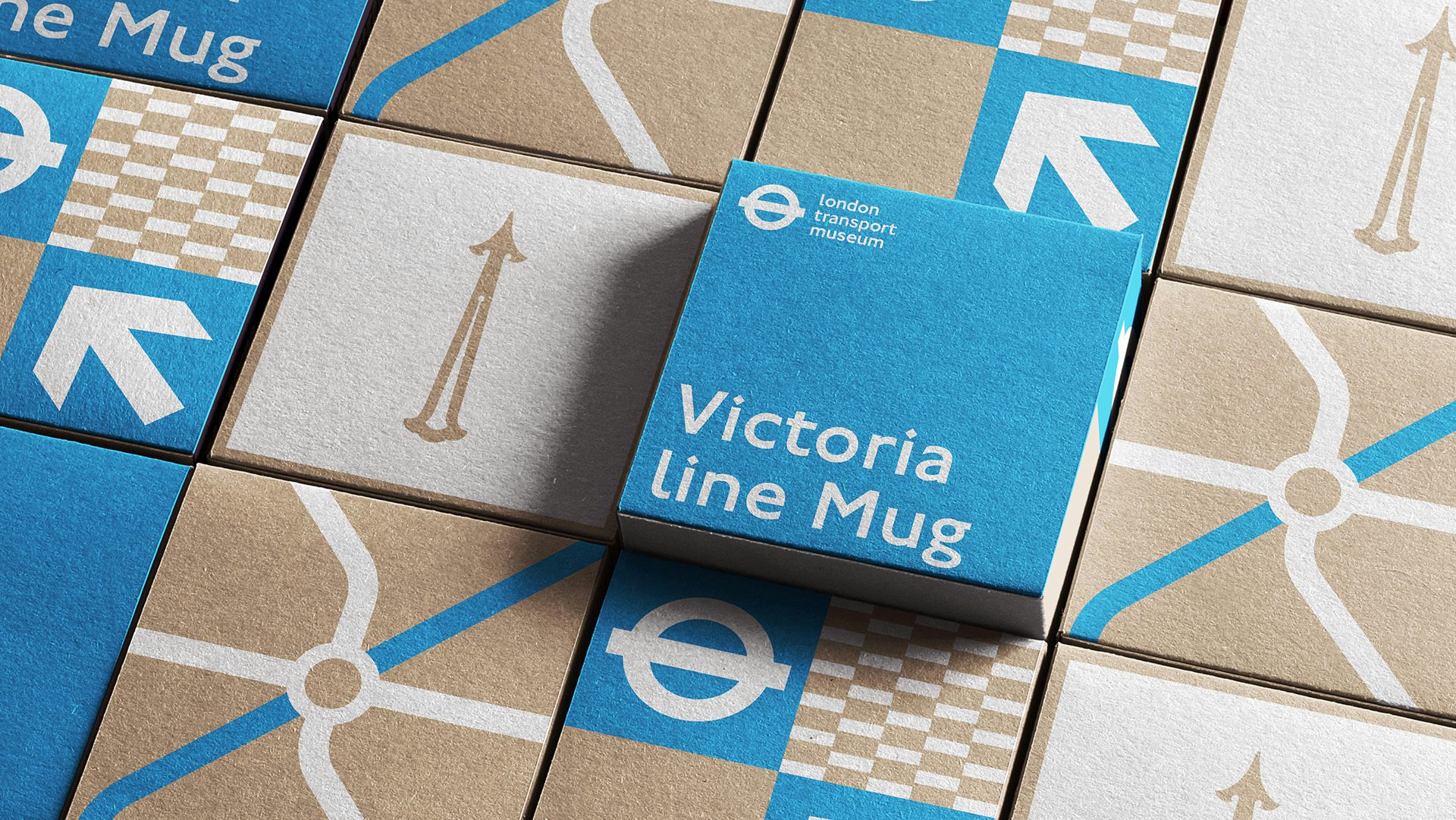 A grid of London Transport Museum packaging boxes in brown and pale blue designs