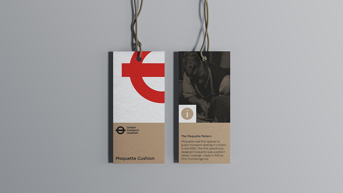 A paper tag in London Transport Museum branding and a brown white and red palette