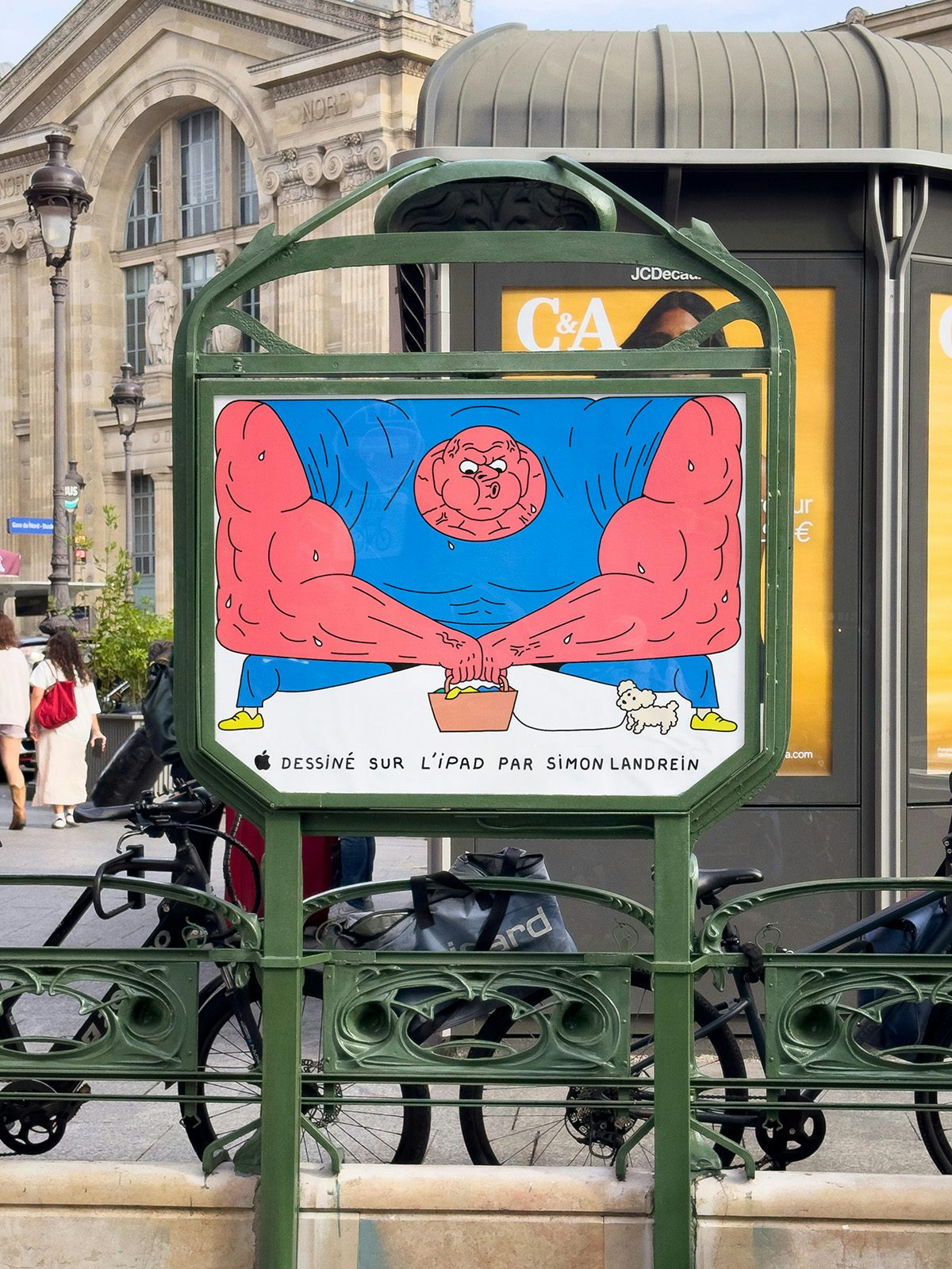 Illustrated poster by Simon Landrein of a bubbly pink character shown beneath a metro station sign