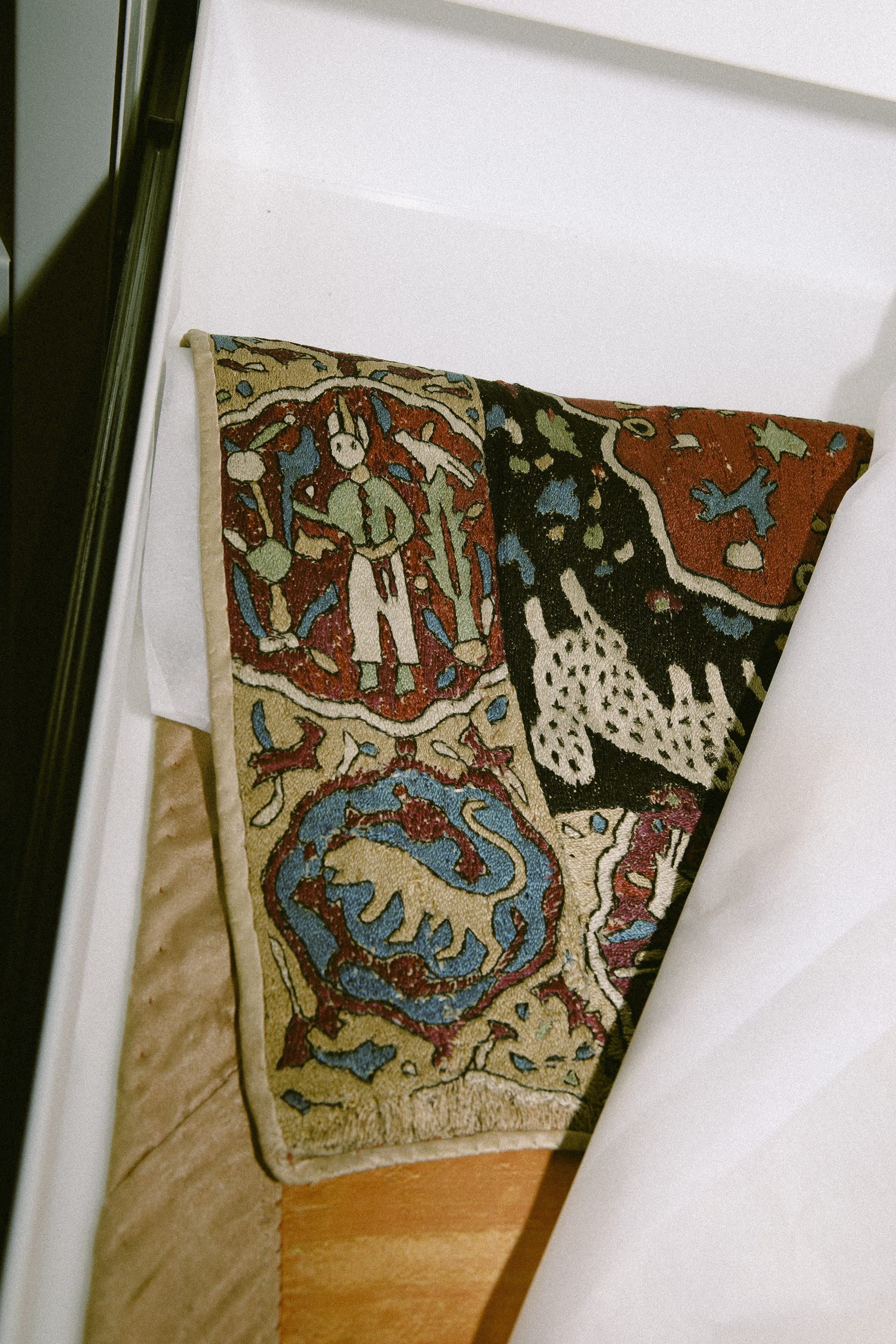 Iranian 1550 - 1600 panel design of lobed medallions with Safavid-style princely figures and animals (shot by Vicky Grout)