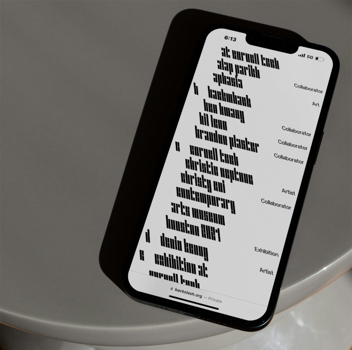 A smartphone showing a list laid out in black backwards slanting letters
