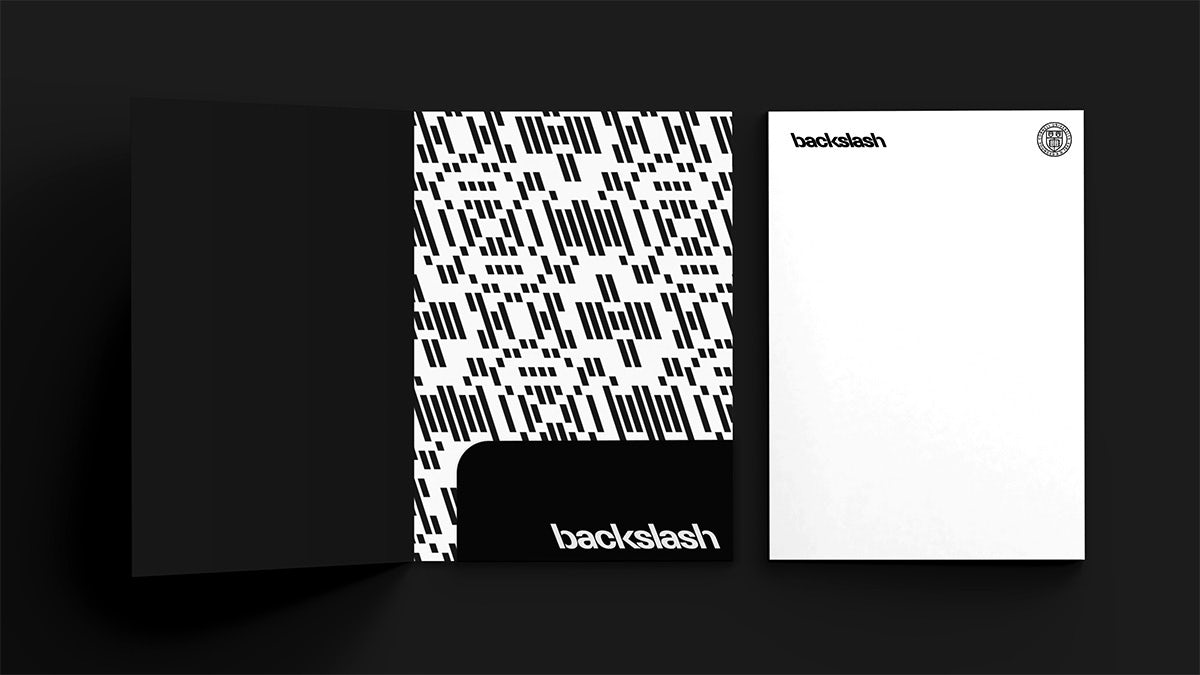 A document folder decorated in backslashes, and a piece of paper with a branded header that reads 'backslash' in backwards sloping letters