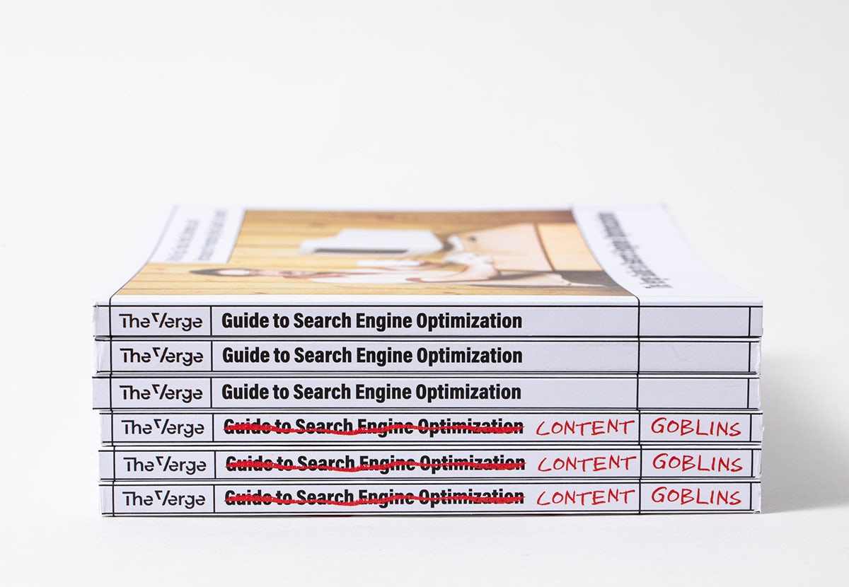Stack of publications by The Verge with a spine that reads 'guide to search engine optimisation' scribbled out and relabelled 'content goblins'