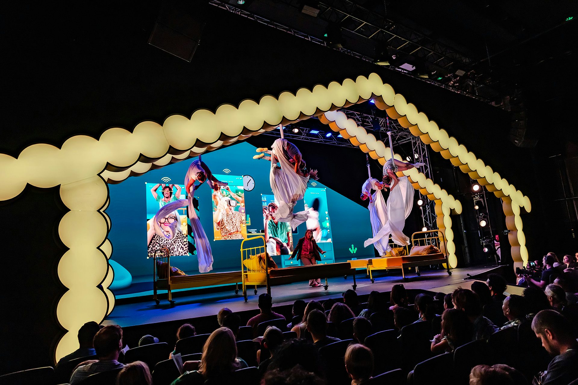 Circus performers on stage at an EE event by Studio Secret Cinema