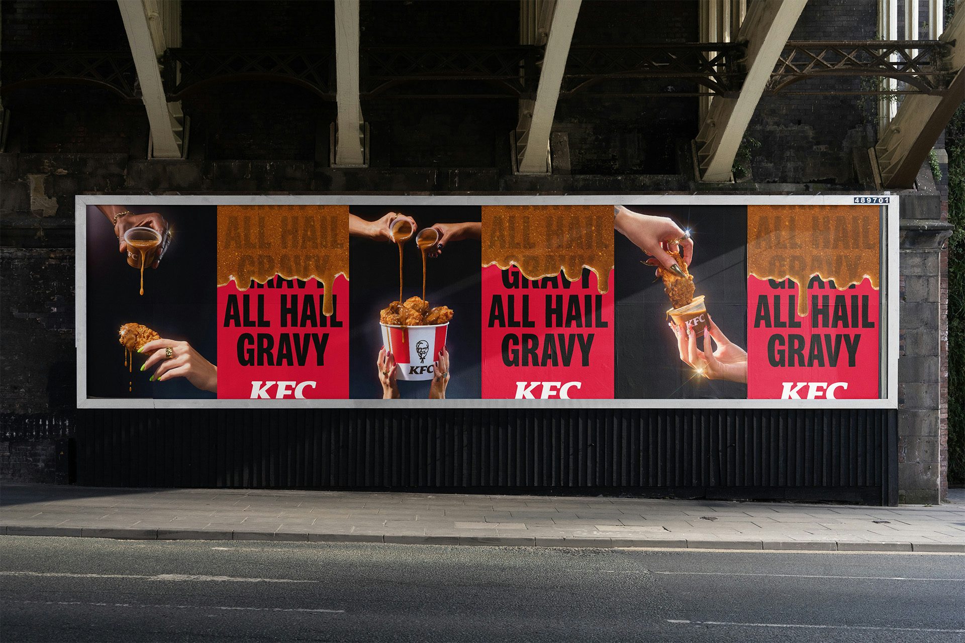 Row of outdoor KFC posters labelled 'all hail gravy' with images of dripping gravy