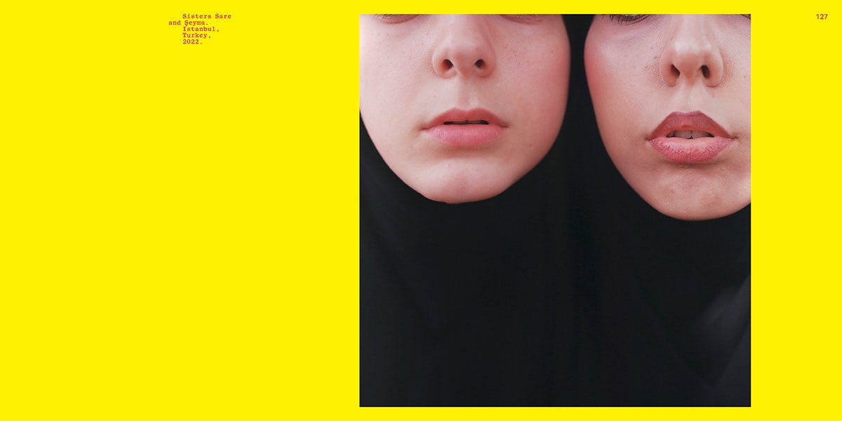 A spread from Mustafa's poetry publication, Nour, featuring a close-up photo of two young women by Sabiha Cimen
