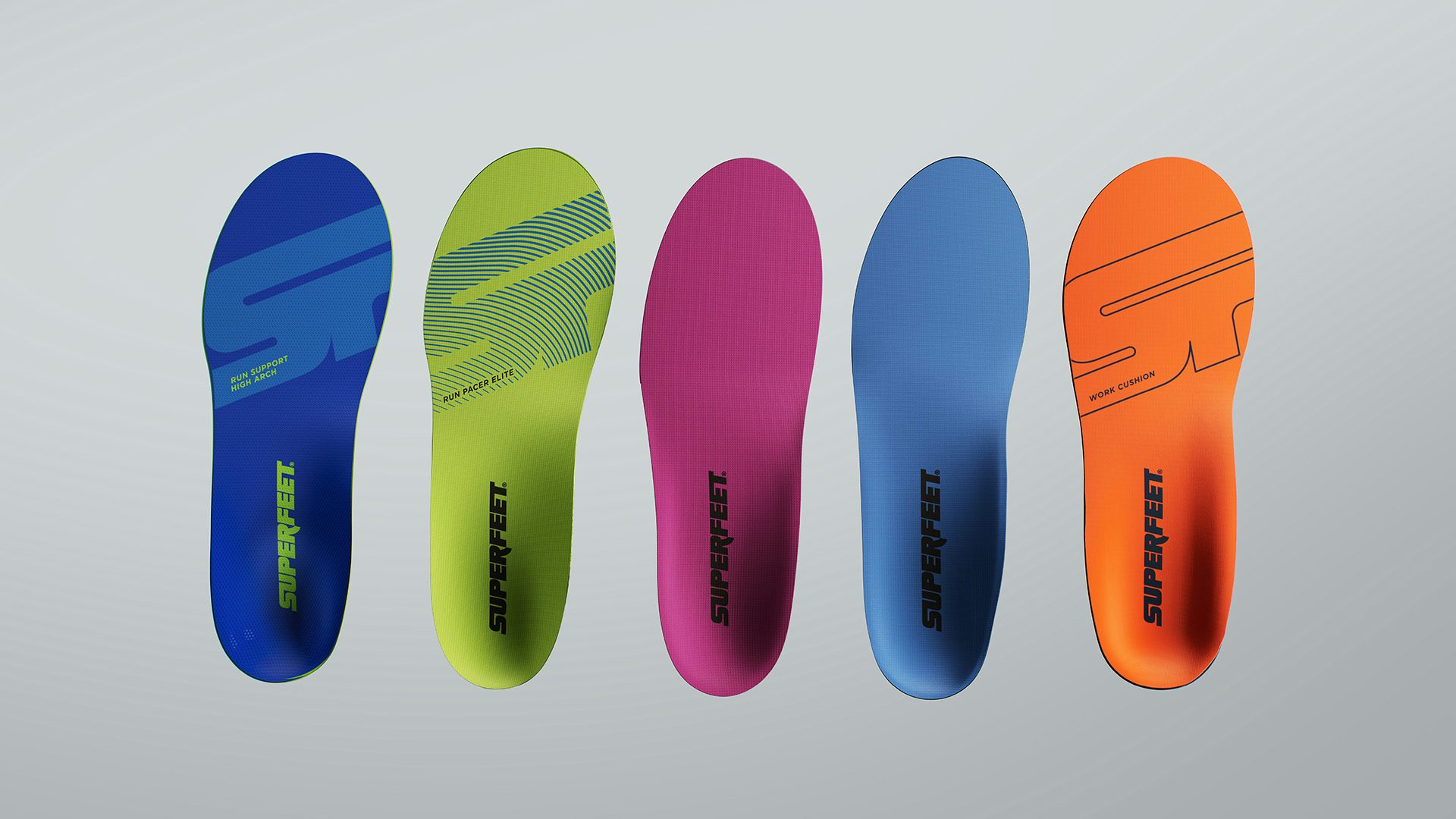 Row of brightly coloured shoe soles featuring the Superfeet wordmark