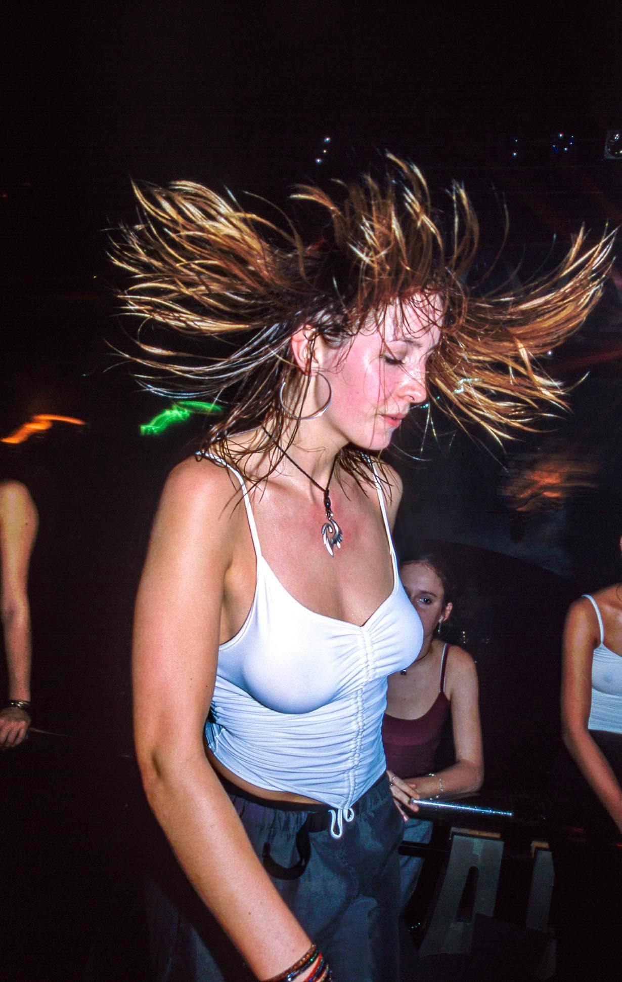 Early 2000s nightlife in all its chaotic, shiny glory