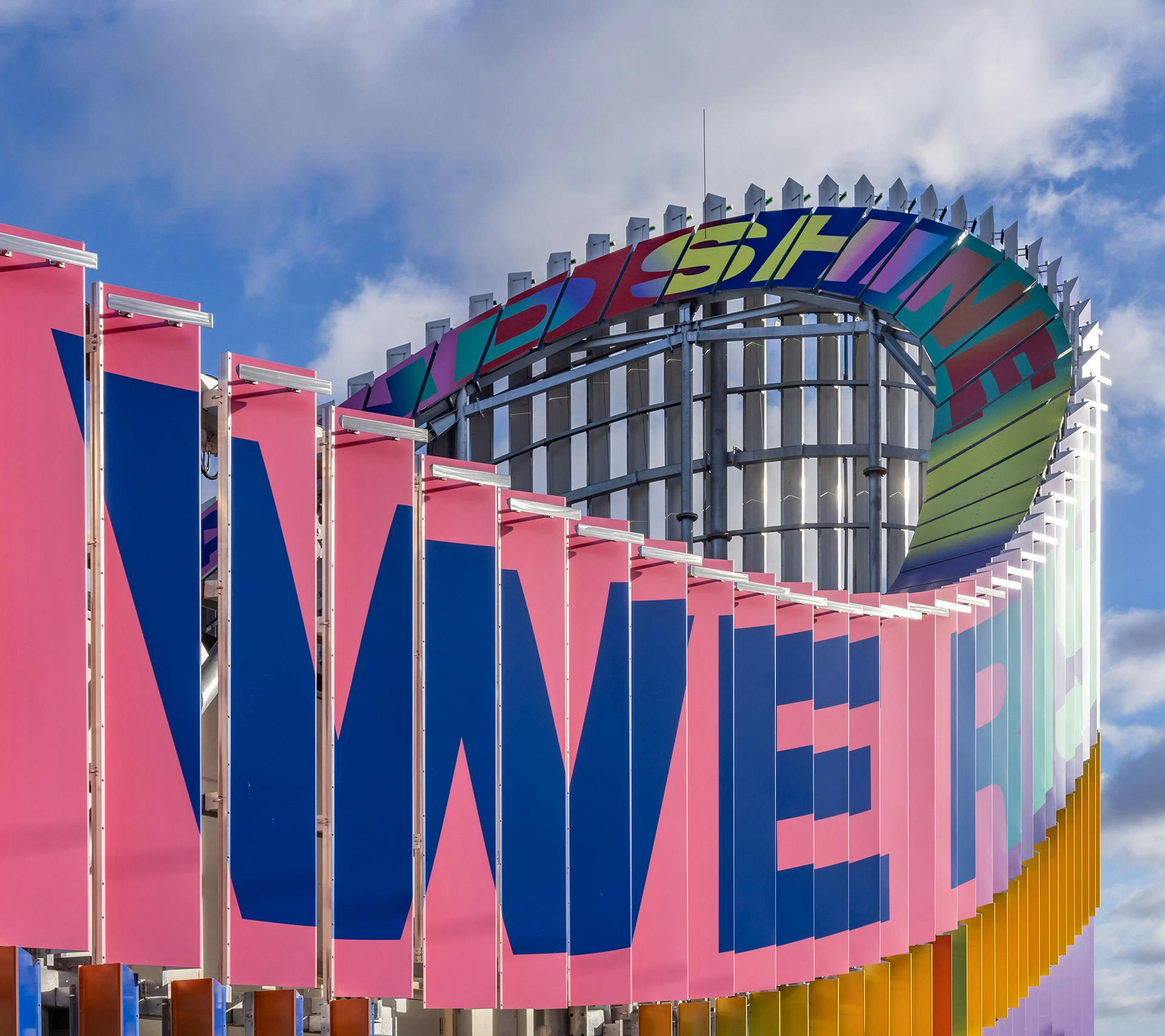 Image shows the colourful exterior of the Brent Cross Town electrical substation designed by artist Lakwena