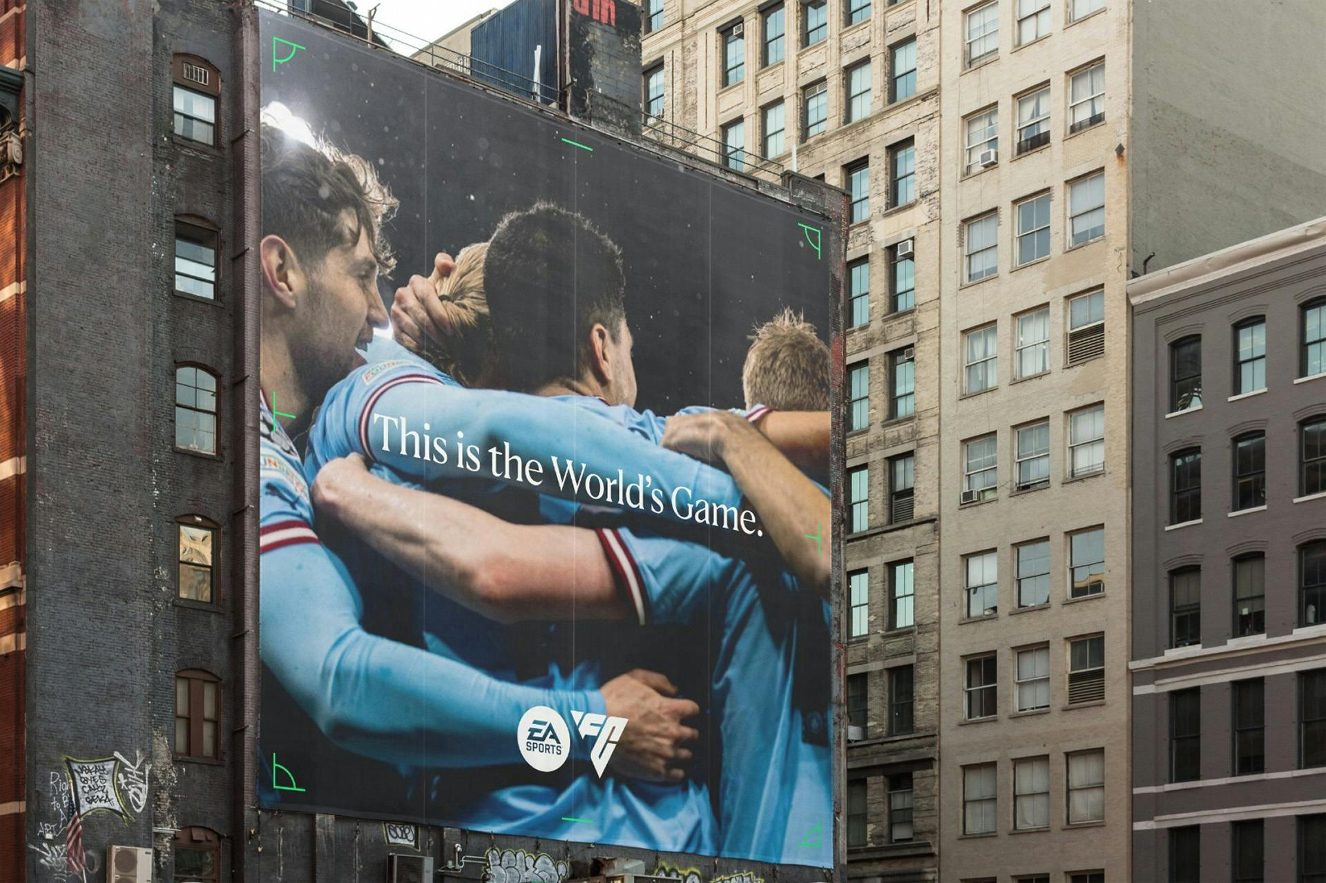 Image of a billboard showing footballers embracing as part of the EA Sports FC launch campaign