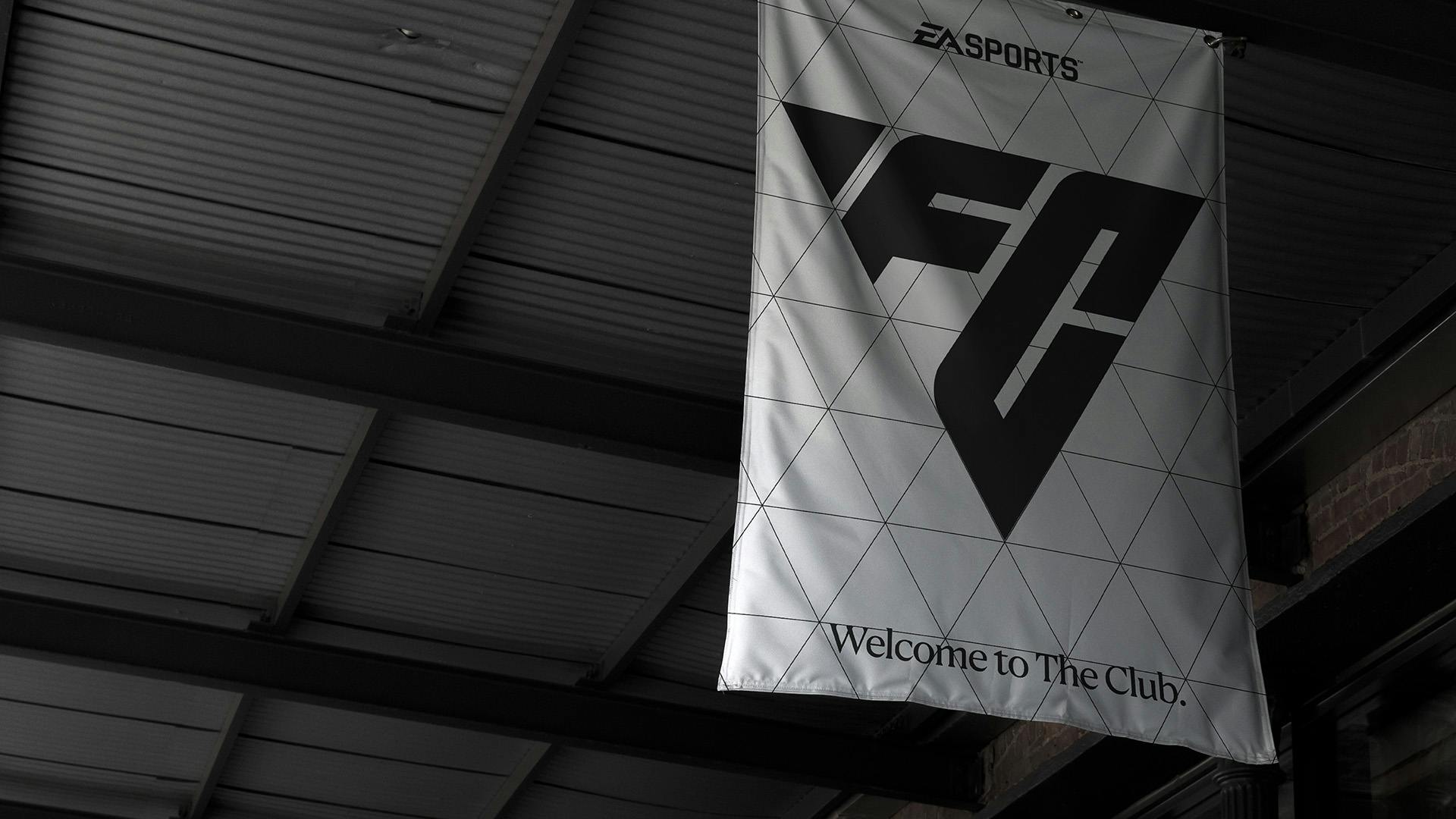 Image showing a white flag at a football ground with the sloping EA Sports FC logo in black lettering