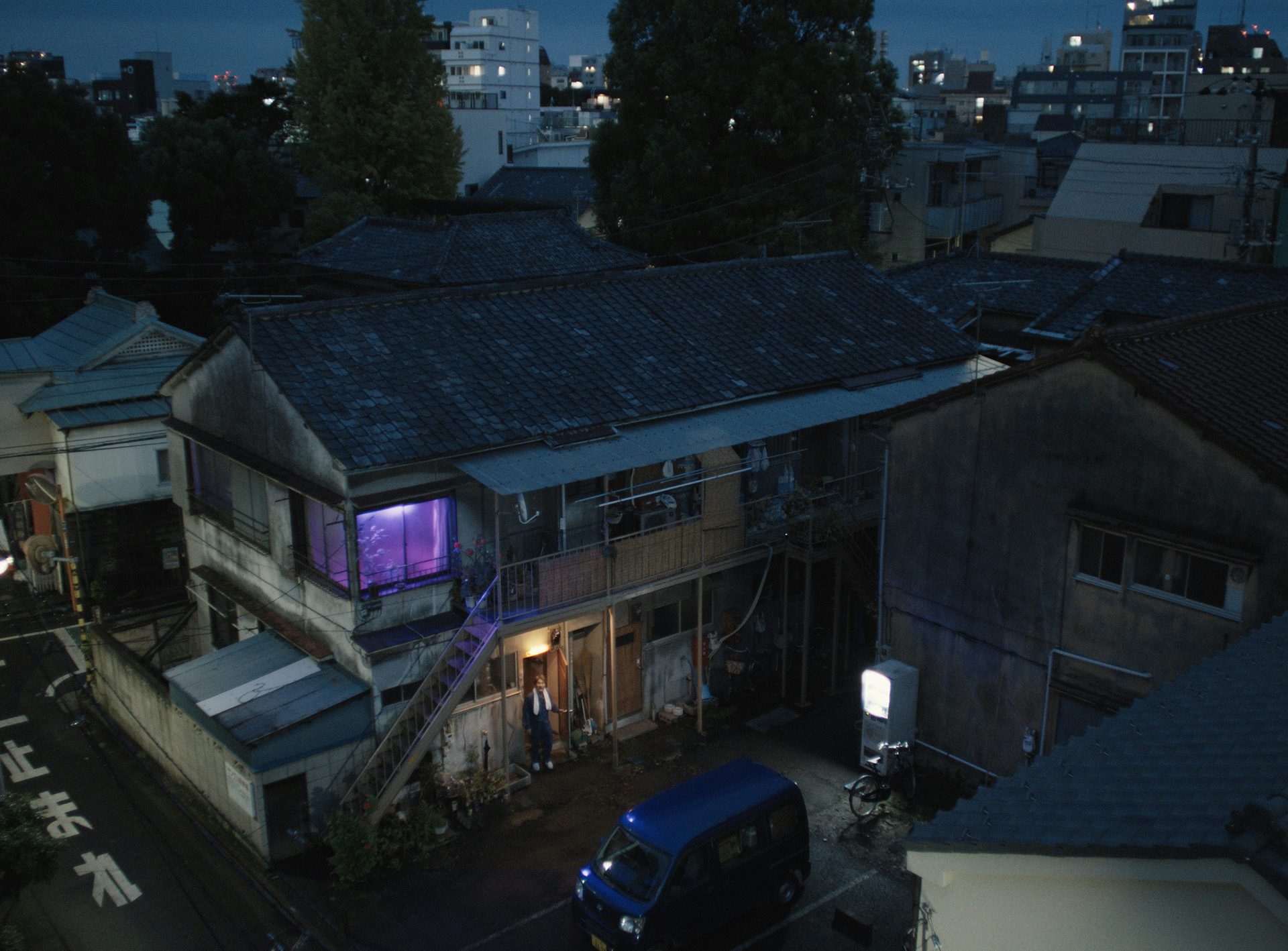 Film still from Perfect Days showing an aerial view of the building where main character Hirayama lives