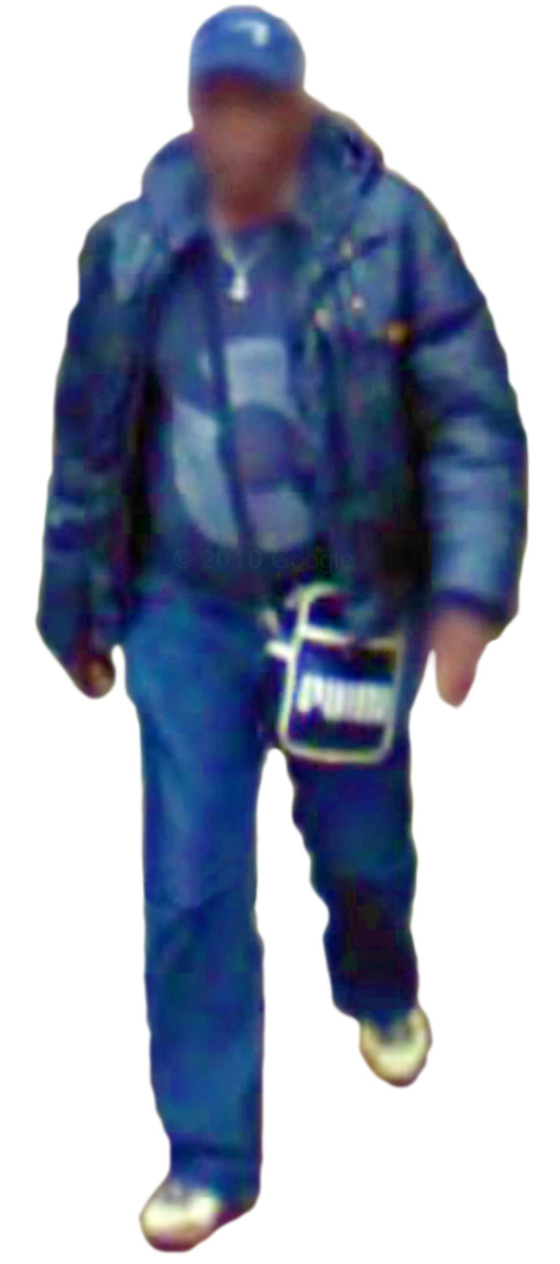 Blurred cut out of a figure wearing a a blue outfit and hat, taken from Google Street View