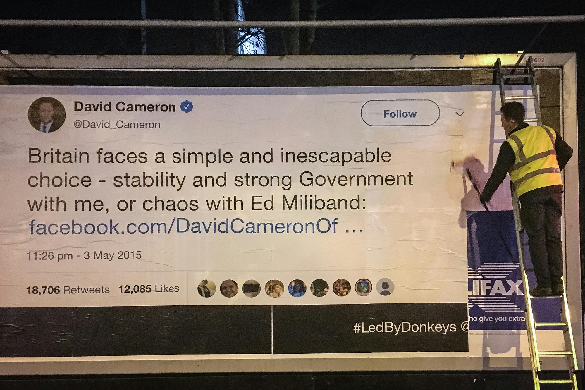 Led By Donkeys plaster David Cameron's quote onto a billboard in Stoke Newington. Photo by Led By Donkeys