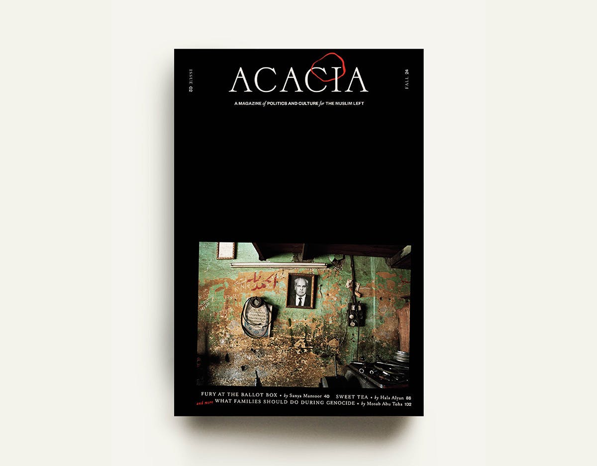 Black cover of Acacia magazine featuring the magazine name at the top with a circle drawn around one of the letters, and at the bottom of the cover is a photo showing a kitchen with dishevelled walls