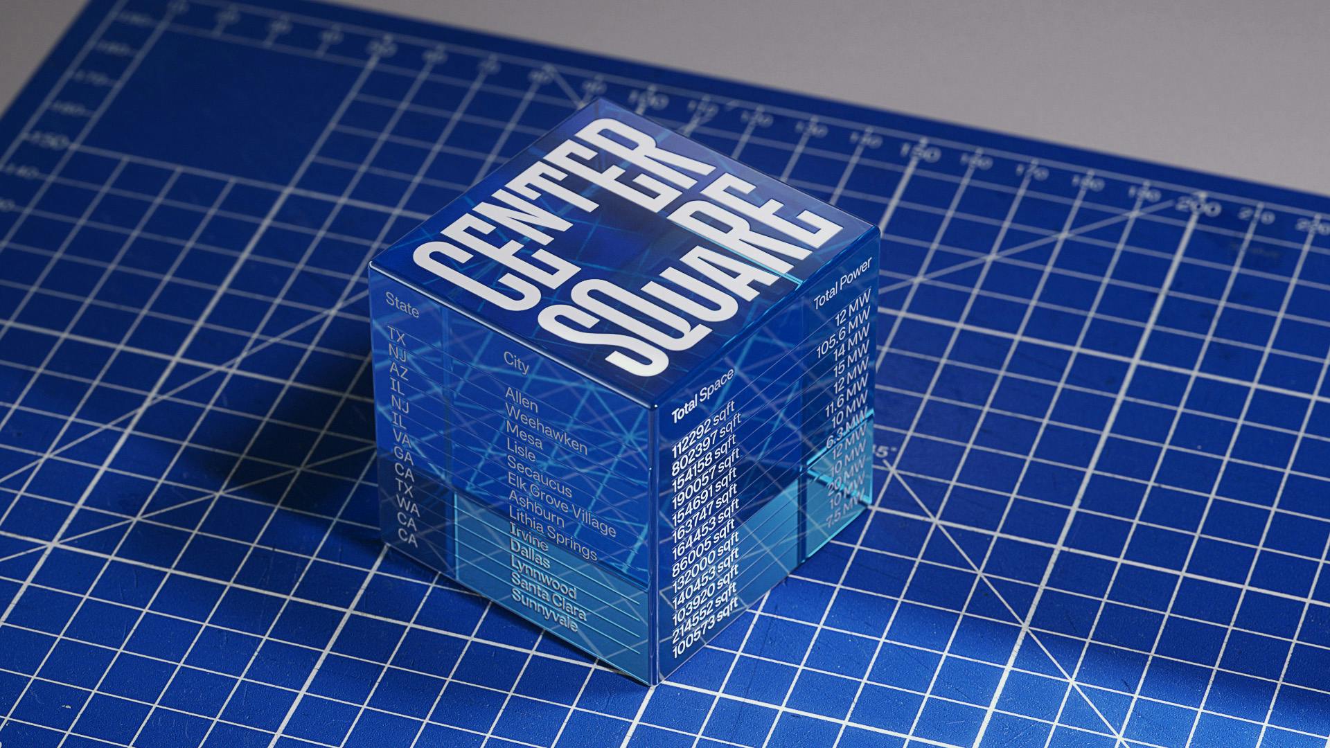 Glass cube featuring the wordmark for Centersquare arranging in a square shape with a cut-out centre