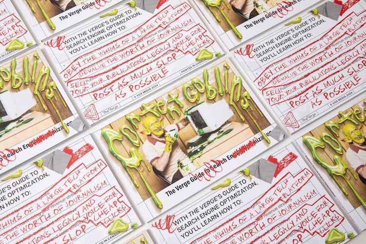 Rows of books by The Verge featuring a photo of an office worker sat in front of a 90s computer, which has been covered in a goblin mask and the headline 'content goblins'