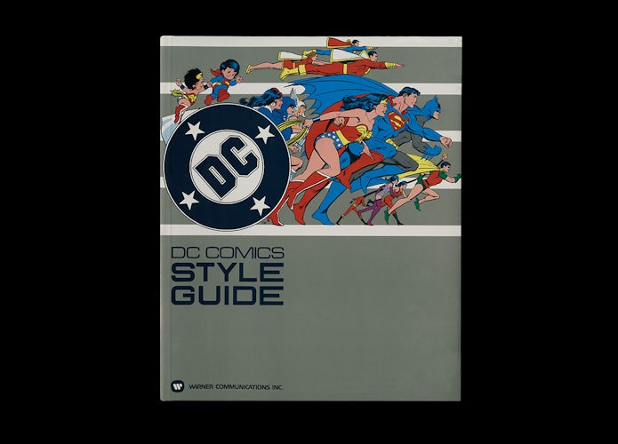 Cover of DC Comics style guide featuring illustrations of Superman, Catwoman, Batman and others appearing to run across the page