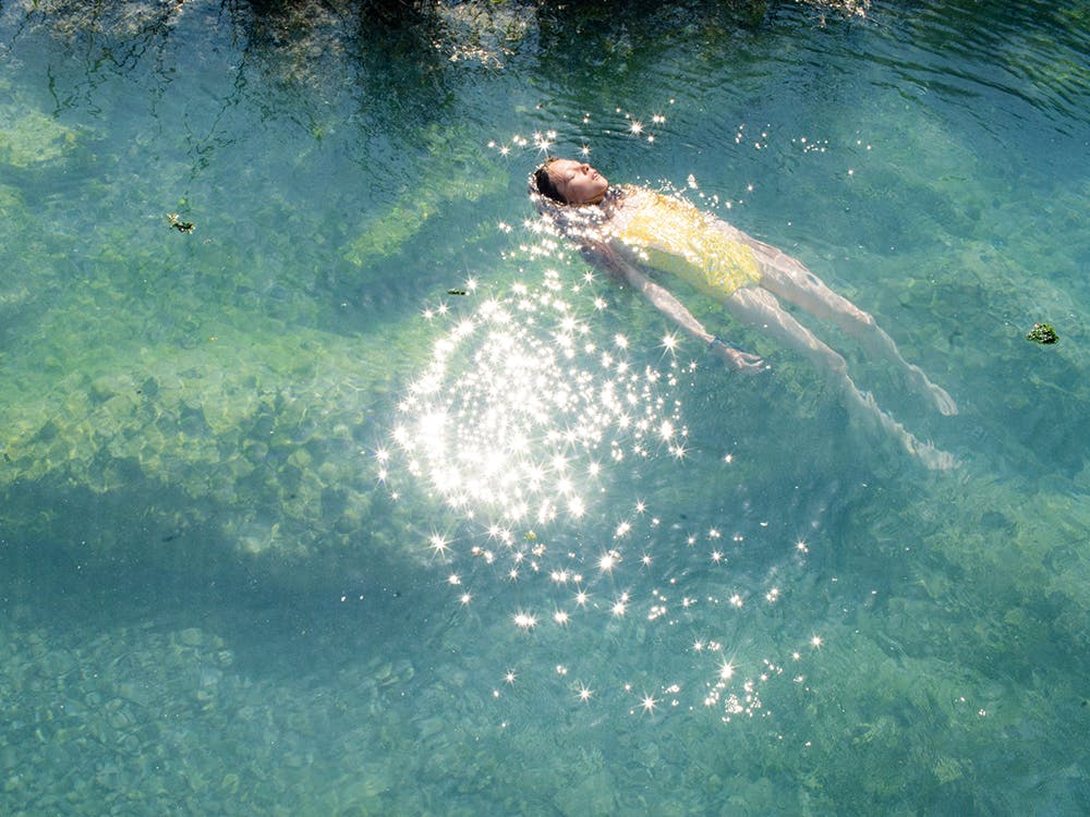 A girl swims in water