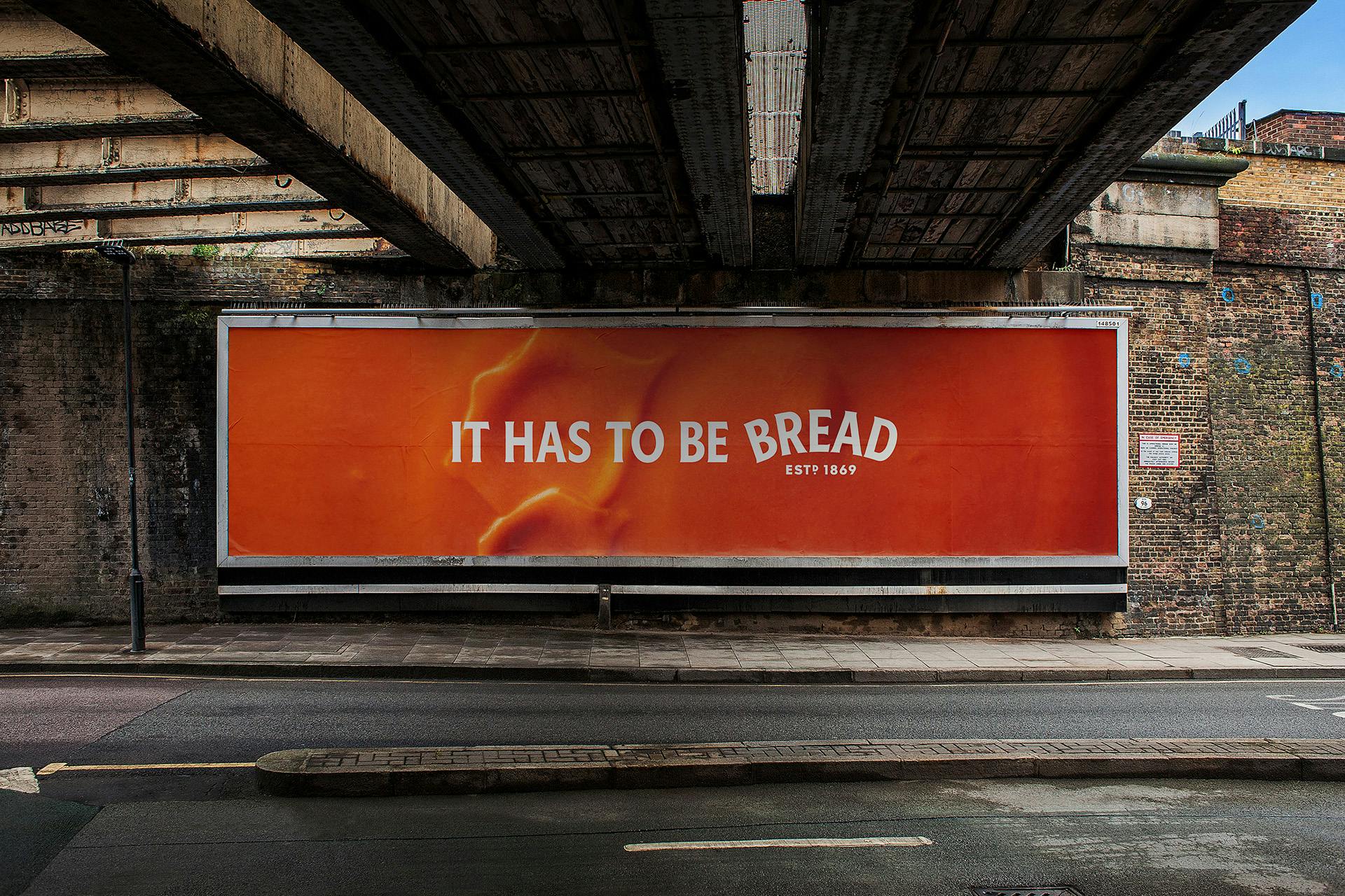 Outdoor ad featuring a close up image of tomato soup overlaid with the endline 'it has to be bread' with the word 'bread' arched in the style of the Heinz logo