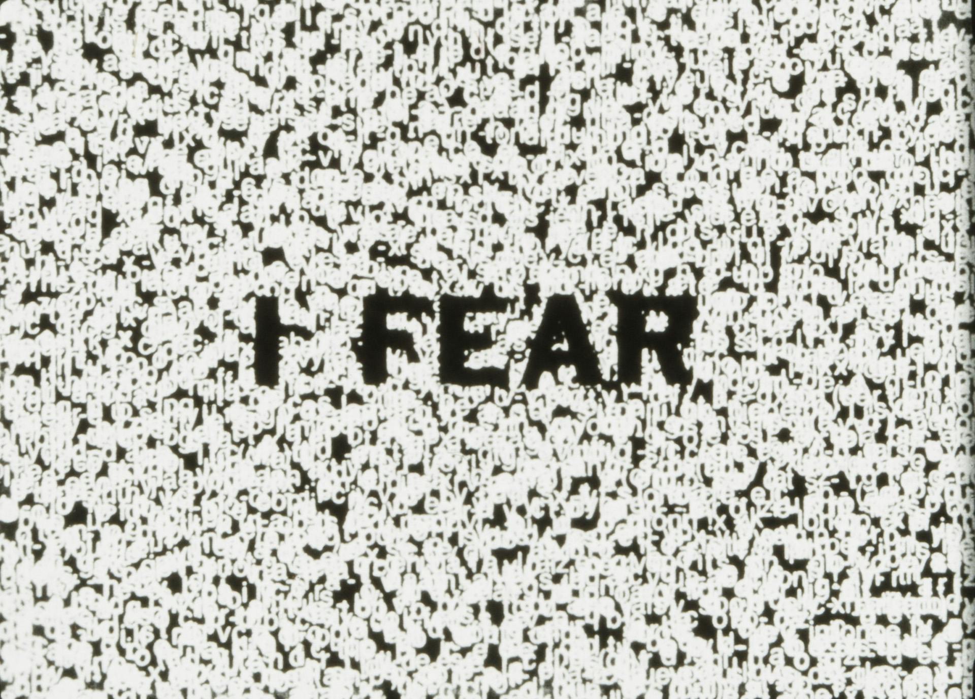 Film still featuring the words 'I fear' in black letters on a distortred black and white background, taken from Mubi's book Read Frame Type Film