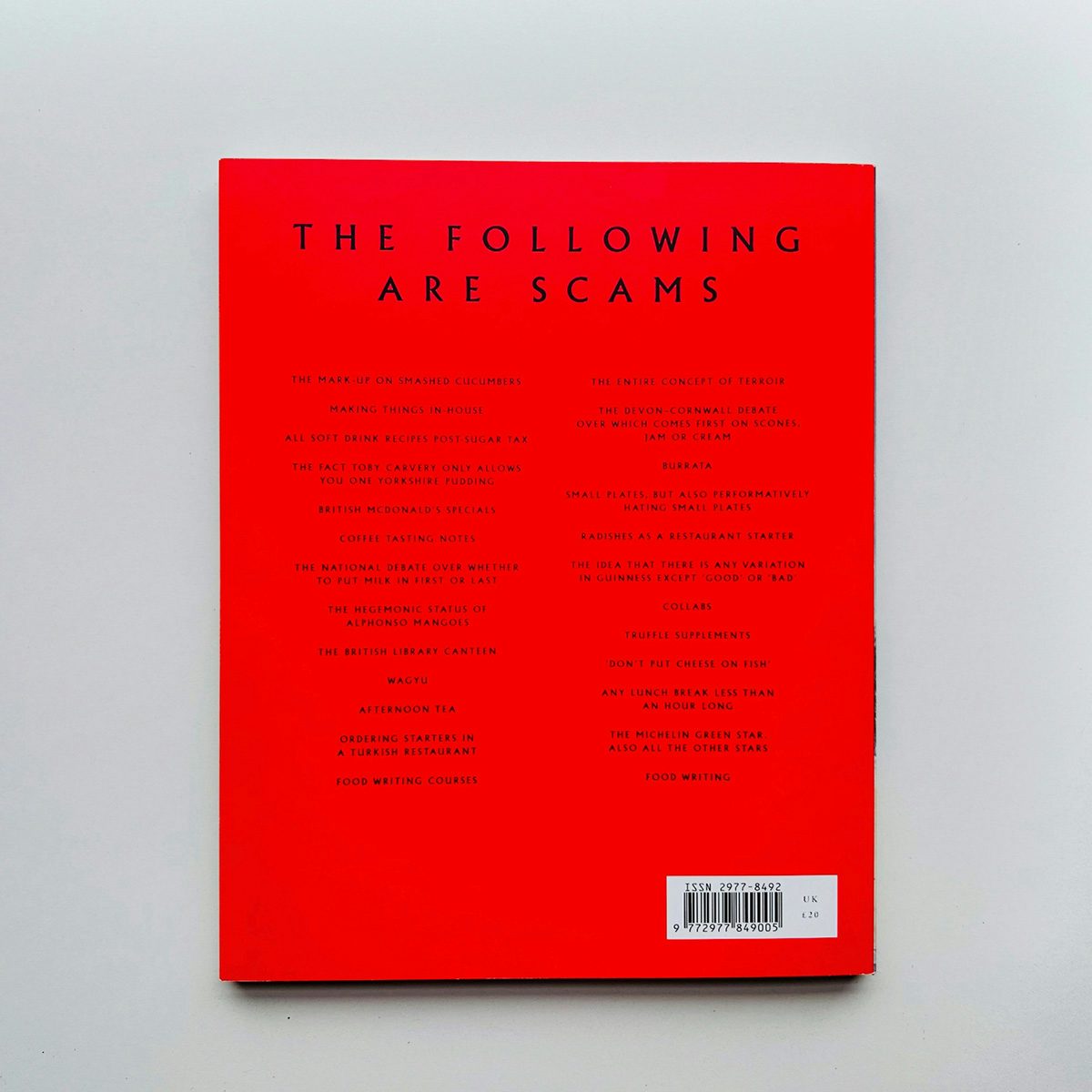 Back cover of Vittles issue one headlined 'the following are scams' on a bright red background
