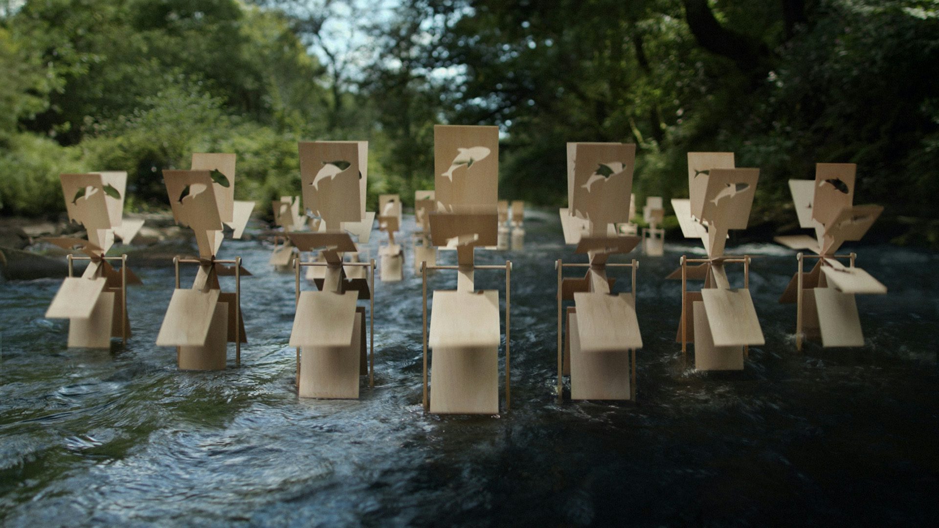 Wooden panels attached to wheels placed in a river