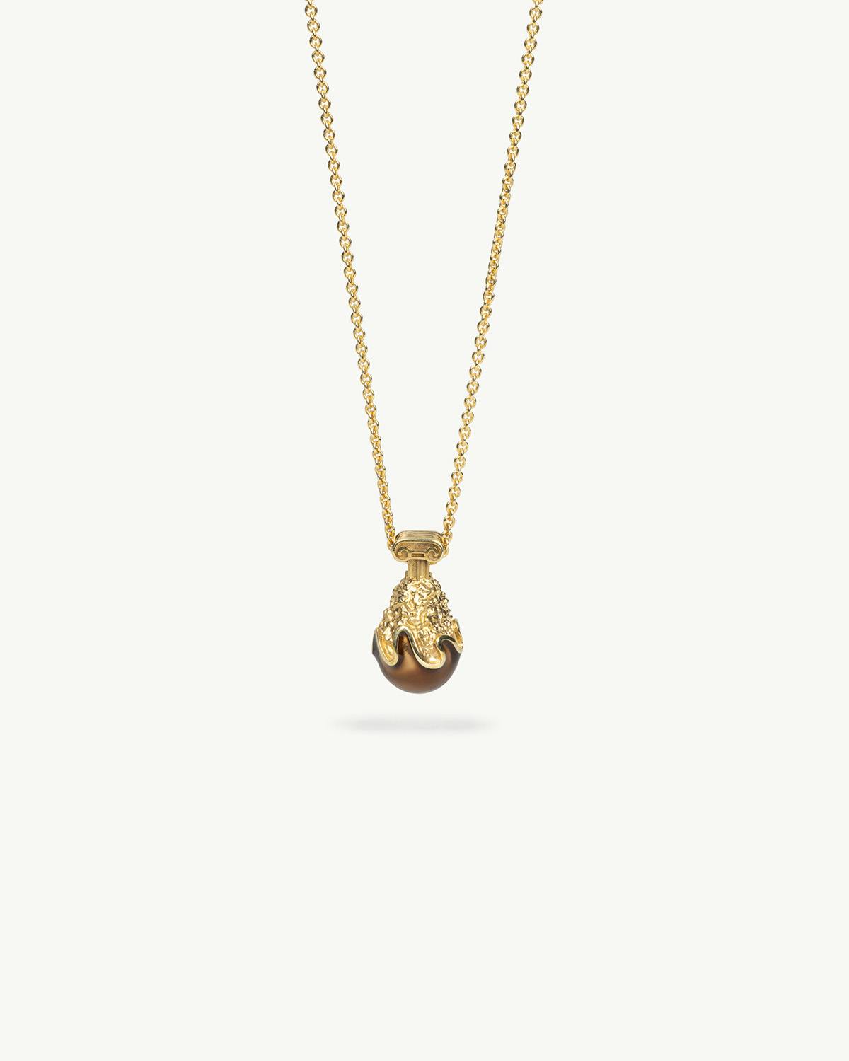 Gold KFC and Aries collab necklace with a chicken-shaped pendant