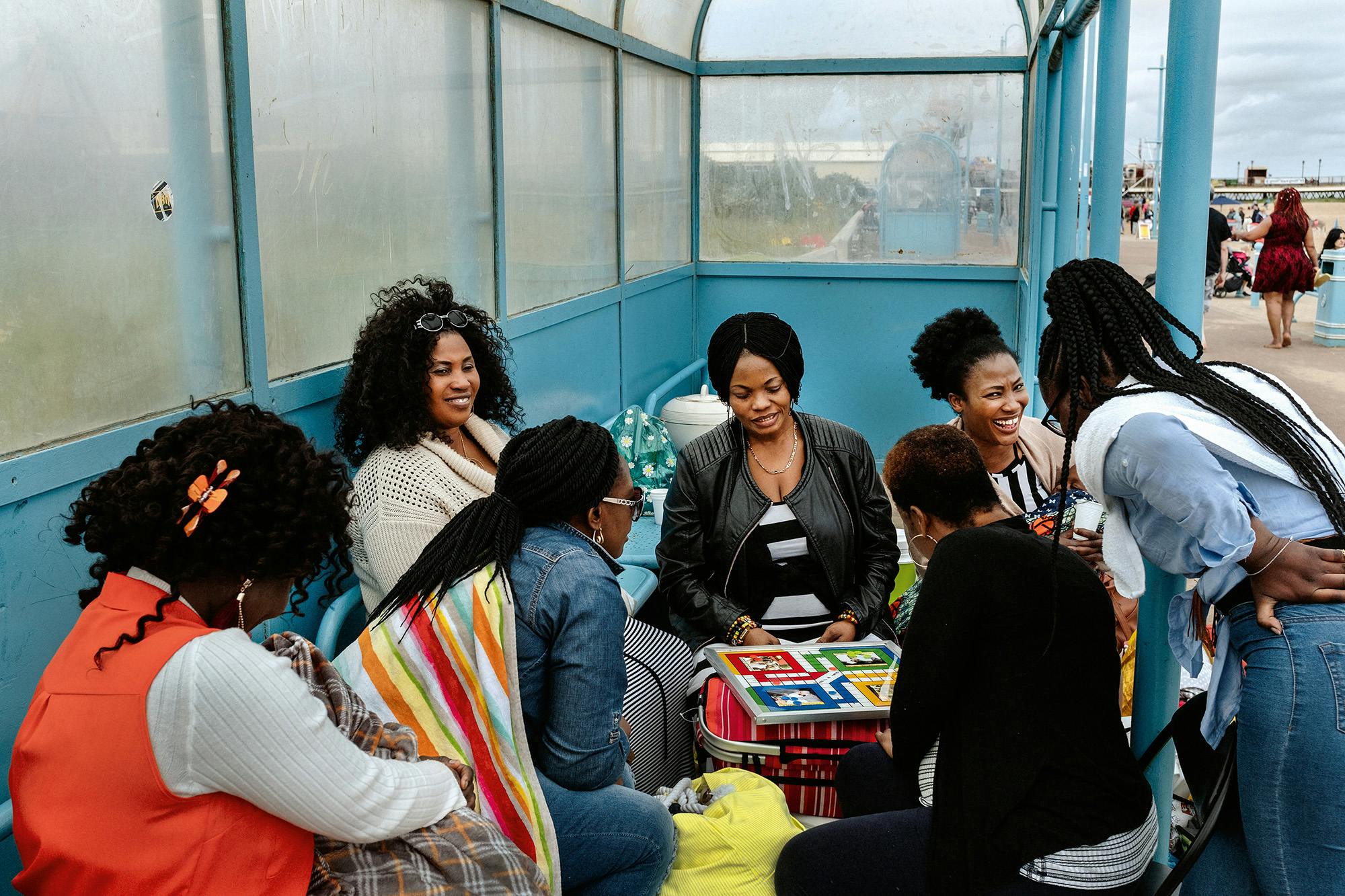 Women playing a board game by the seaside in Skegness, from Merlin Daleman's book Mutiny