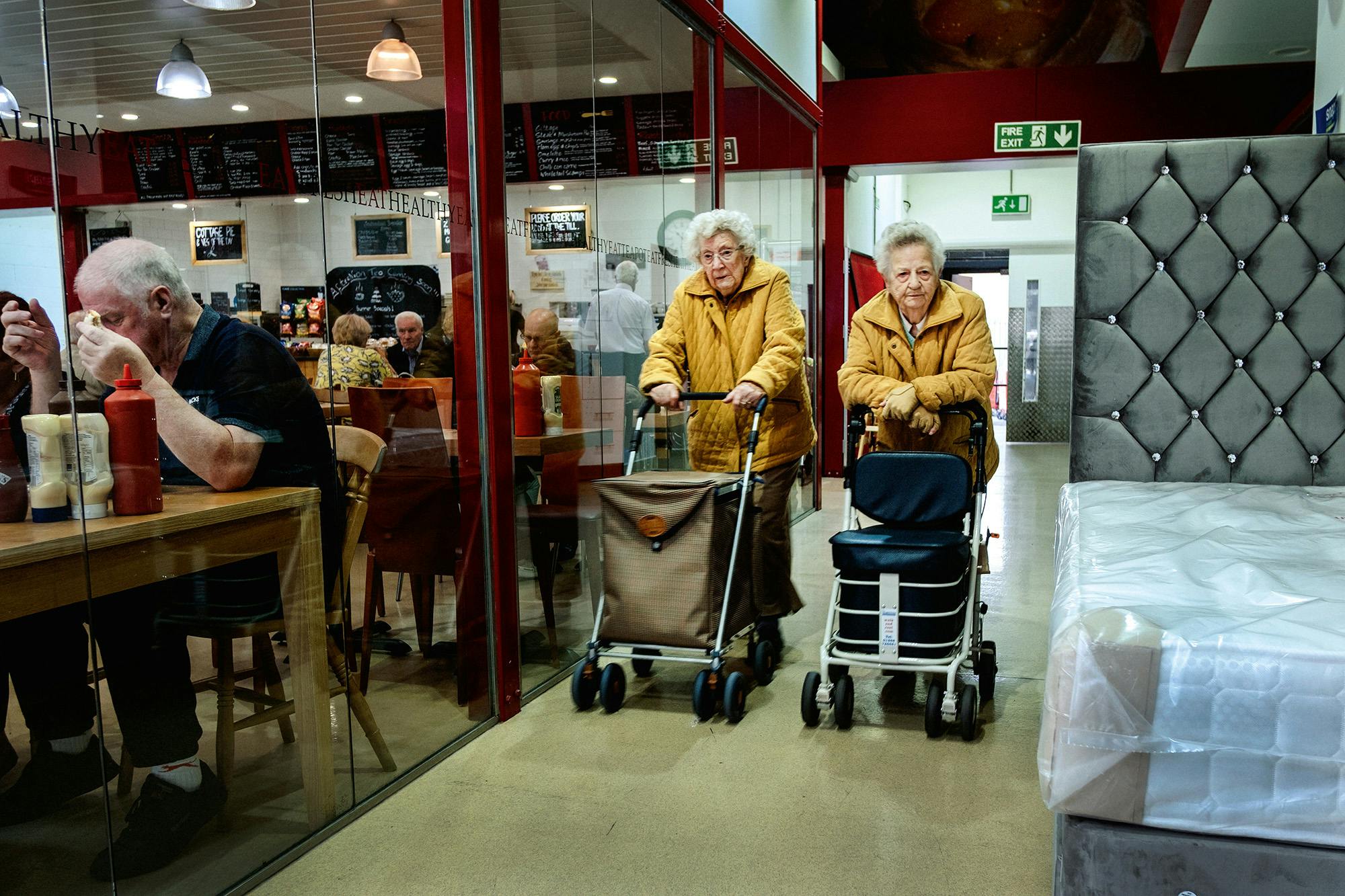 Two women in a shopping mall in Romford, from Merlin Daleman's book Mutiny