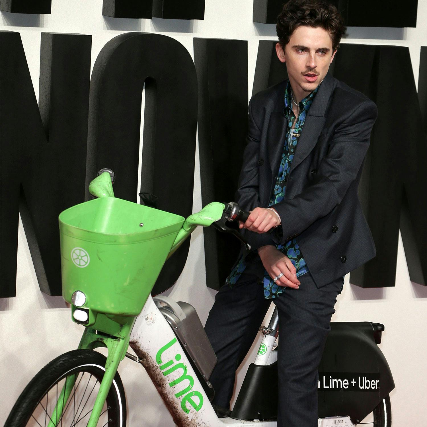 Timothée Chalamet on a Lime bike at the London premiere of A Complete Unknown