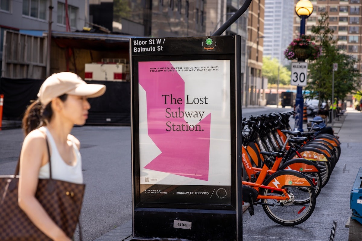 Museum of Toronto outdoor ad featuring an arrow and a headline that reads 'The lost subway station'